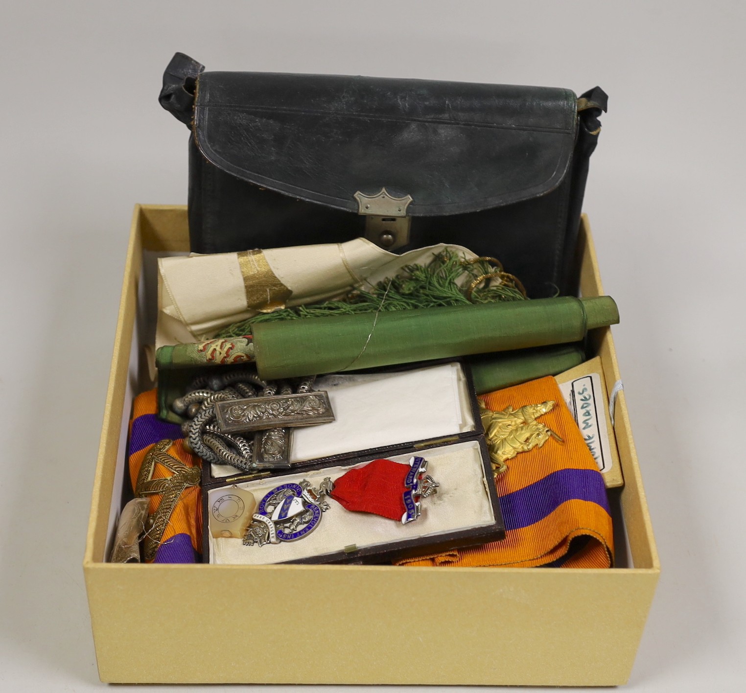 A Masonic silver jewel, various sashes, epaulette’s etc